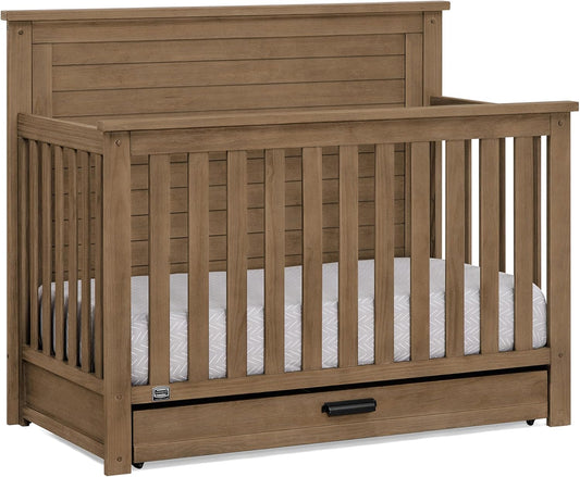 Delta Children Simmons Kids Caden 6-in-1 Convertible Crib with Trundle Drawer, Greenguard Gold Certified, Aged Oak